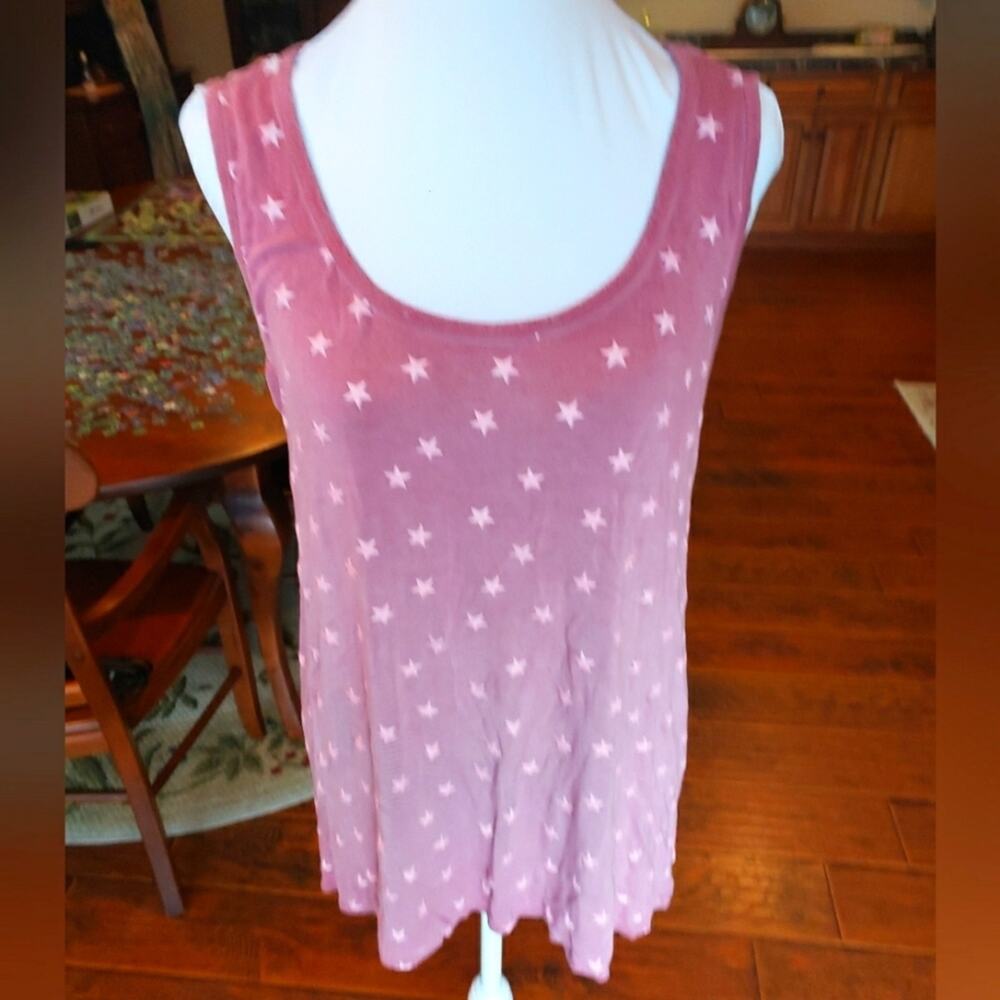 This is a Jade sleeveless 95% viscose 5% spandex pullover shirt‎